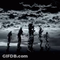 Group Of People Standing In Front Of Cloudy Sky GIF