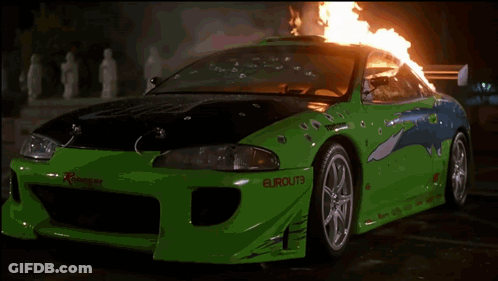 Group Of People Standing In Front Of Fire At Night GIF