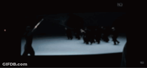 Group Of People Standing In Front Of Large Building GIF