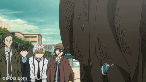 Group Of People Standing In Front Of Large Wall GIF