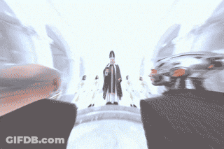 Group Of People Standing In Front Of Priest GIF