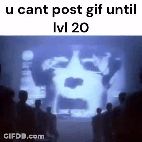 Group Of People Standing In Front Of Screen With Face GIF