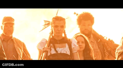 Group Of People Standing In Front Of Sun GIF