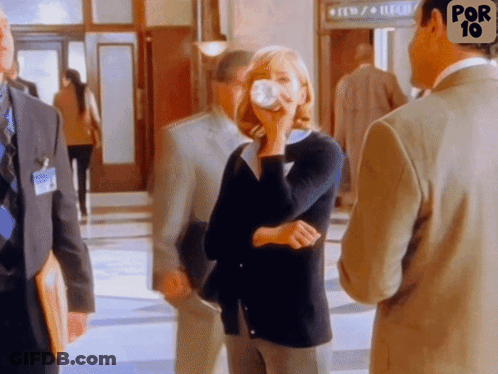 Group Of People Standing In Hallway With Por 10 Sign GIF