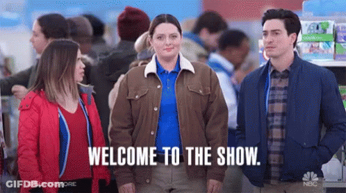 Group Of People Standing In Line With Woman In Middle GIF