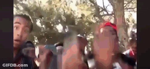 Group Of People Standing In Park GIF