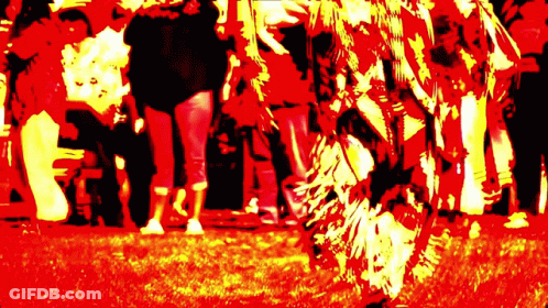 Group Of People Standing In Red And Yellow Field GIF
