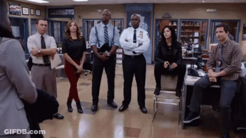 Group Of People Standing In Room GIF