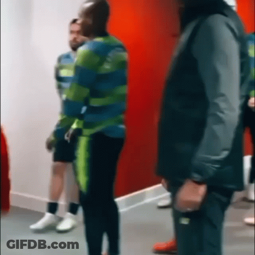 Group Of People Standing In Room GIF