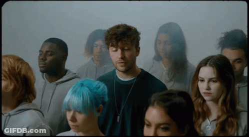 Group Of People Standing In Room GIF