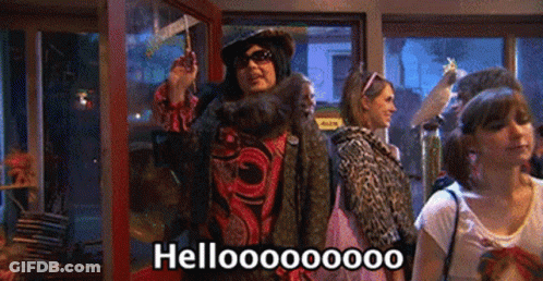 Group Of People Standing In Room Saying Hello GIF