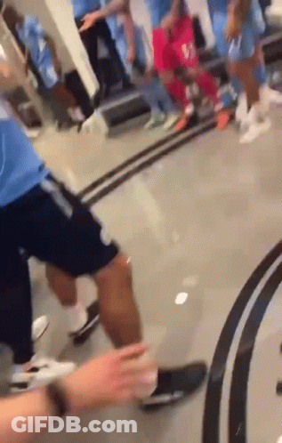 Group Of People Standing In Room With Mirror GIF