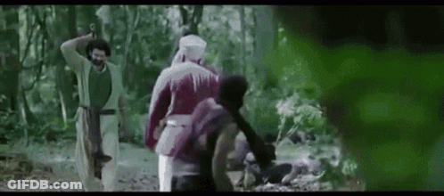 Group Of People Standing In Woods GIF