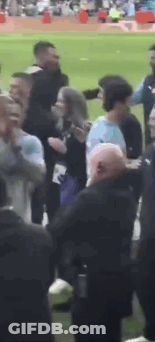 Group Of People Standing On Baseball Field GIF