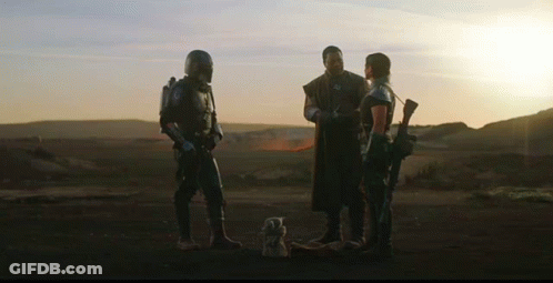 Group Of People Standing On Dirt Field GIF