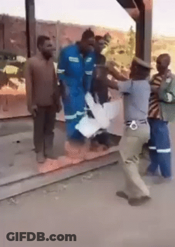 Group Of People Standing On Sidewalk GIF