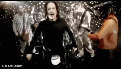 Group Of People Standing On Stage In Front Of Curtain GIF