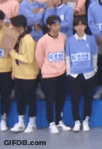 Group Of People Standing Together GIF