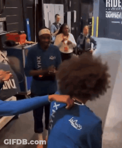 Group Of People Standing With Ride Sign GIF