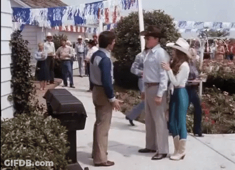 Group Of People Talking On Sidewalk GIF
