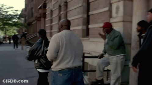 Group Of People Talking Outside Building GIF