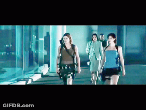 Group Of People Walking In Dark Room GIF
