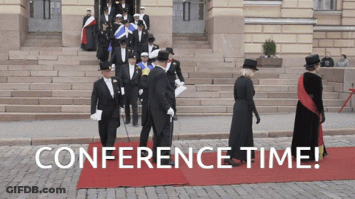 Group Of People Walking On Red Carpet With Conference Time GIF