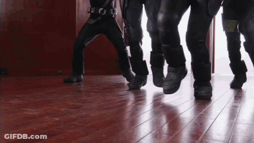 Group Of People Walking On Wood Floor GIF