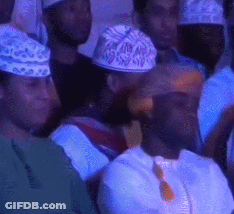 Group Of People Wearing Hats Sitting In Room GIF