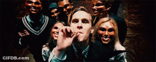 Group Of People Wearing Masks Posing GIF