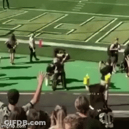 Group Of People With Arms In Air On Football Field GIF