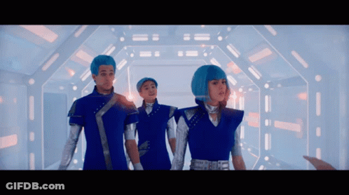 Group Of People With Blue Hair In Hallway GIF