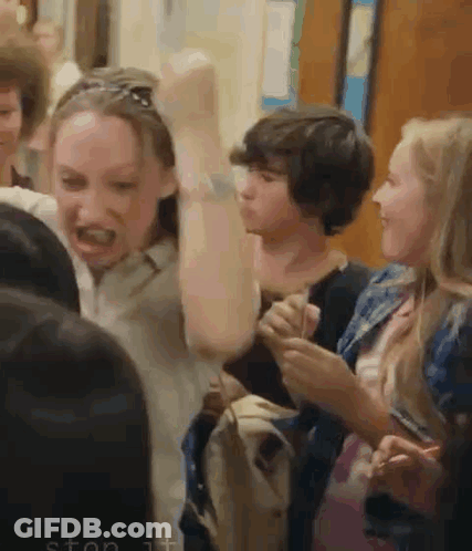 Group Of People With Hands In The Air GIF