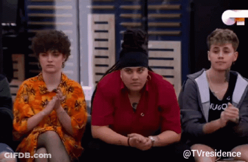 Group Of People With Hugo On Red Shirt GIF