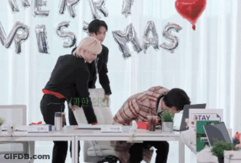 Group Of People With Merry Christmas Balloons GIF