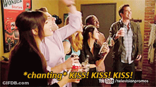 Group Of People With Text Chanting Kiss Kiss Kiss GIF