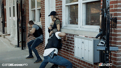 Group Of Police Officers In Front Of Brick Building With #Chicagopd GIF