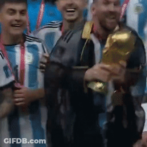 Group Of Soccer Players Holding Trophy And Smiling GIF