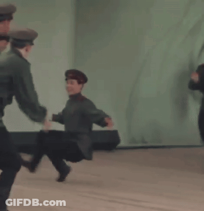Group Of Soldiers Dancing Together On Stage GIF