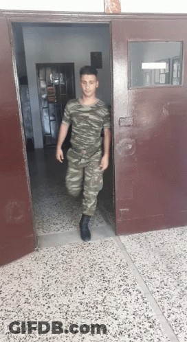 Group Of Soldiers Holding Guns In Field GIF
