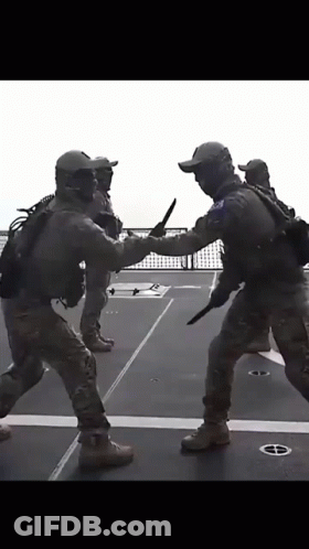 Group Of Soldiers Holding Knives GIF