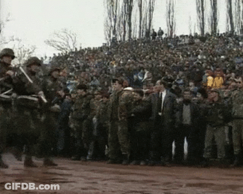 Group Of Soldiers In Front Of Crowd GIF