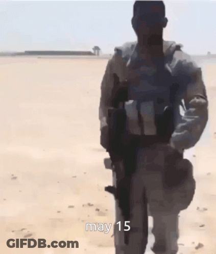 Group Of Soldiers Walking In Desert May 15 GIF