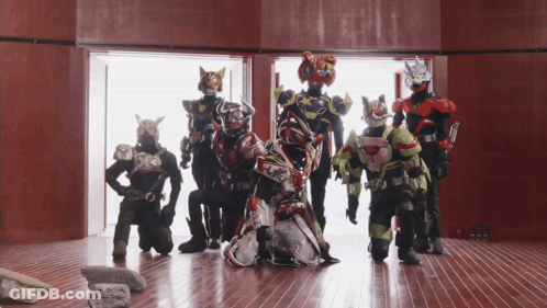 Group Of Superheroes Posing For Photo GIF