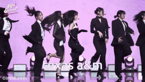 Group Of Women Dancing Before Purple Texas A&M Background GIF