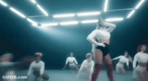 Group Of Women Dancing In Dark Room GIF