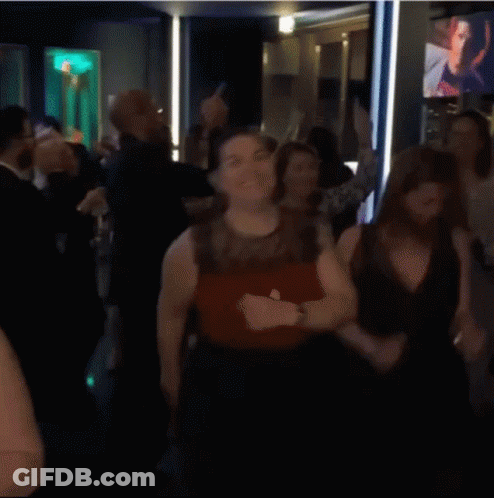 Group Of Women Dancing In Room With TV GIF