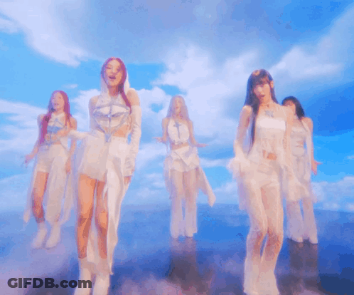 Group Of Women Dancing Under Cloudy Sky GIF