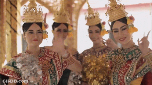 Group Of Women In Traditional Costume And Crowns GIF