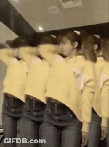 Group Of Women In Yellow Shirts And Jeans In Front Of Mirror GIF